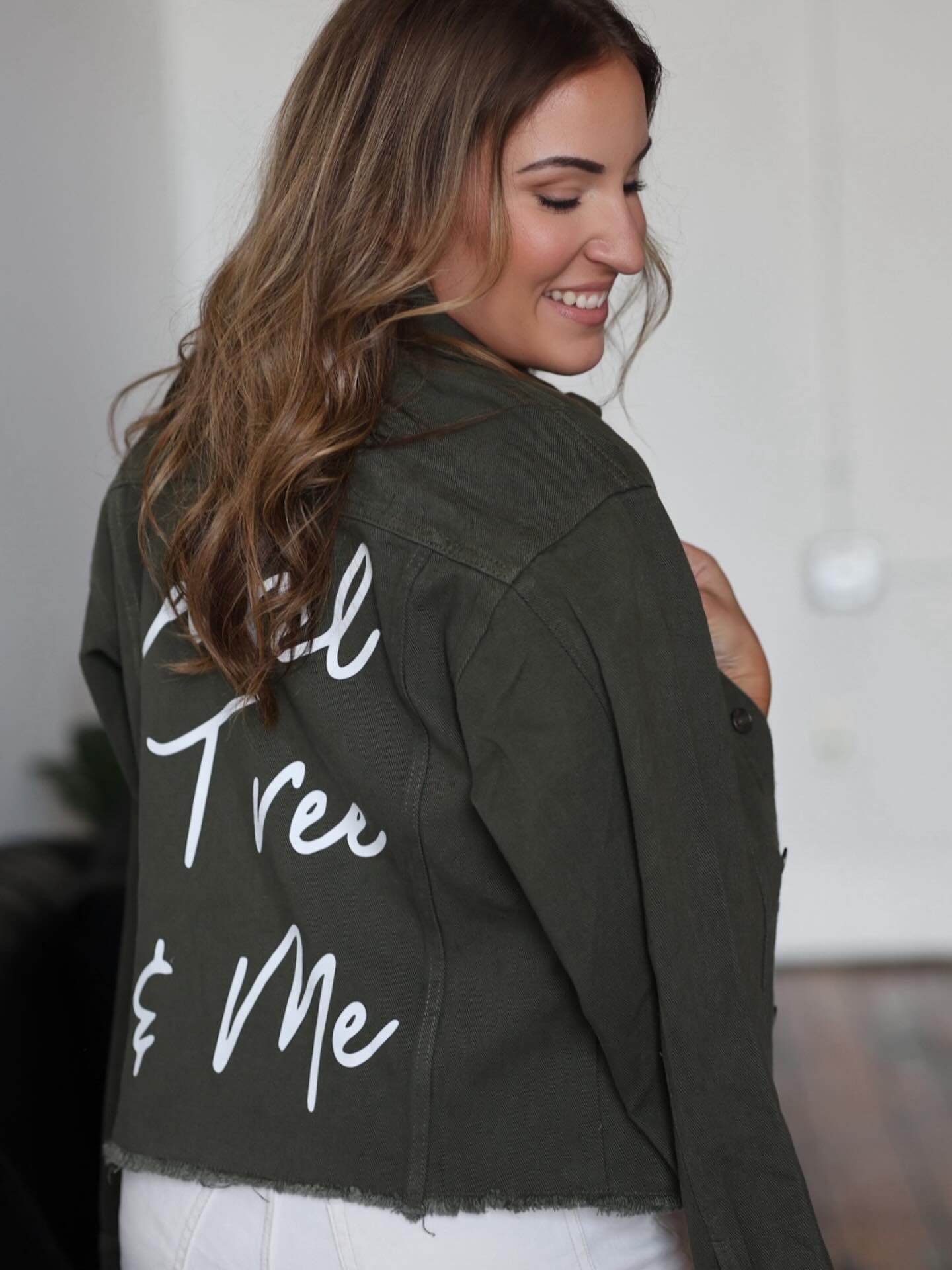 Olive customized denim jacket with white Laurel Tree and Me lettering across the back